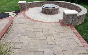 Patio with firepit and red brick border