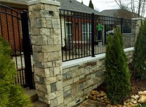 Stone wall with metal fencing